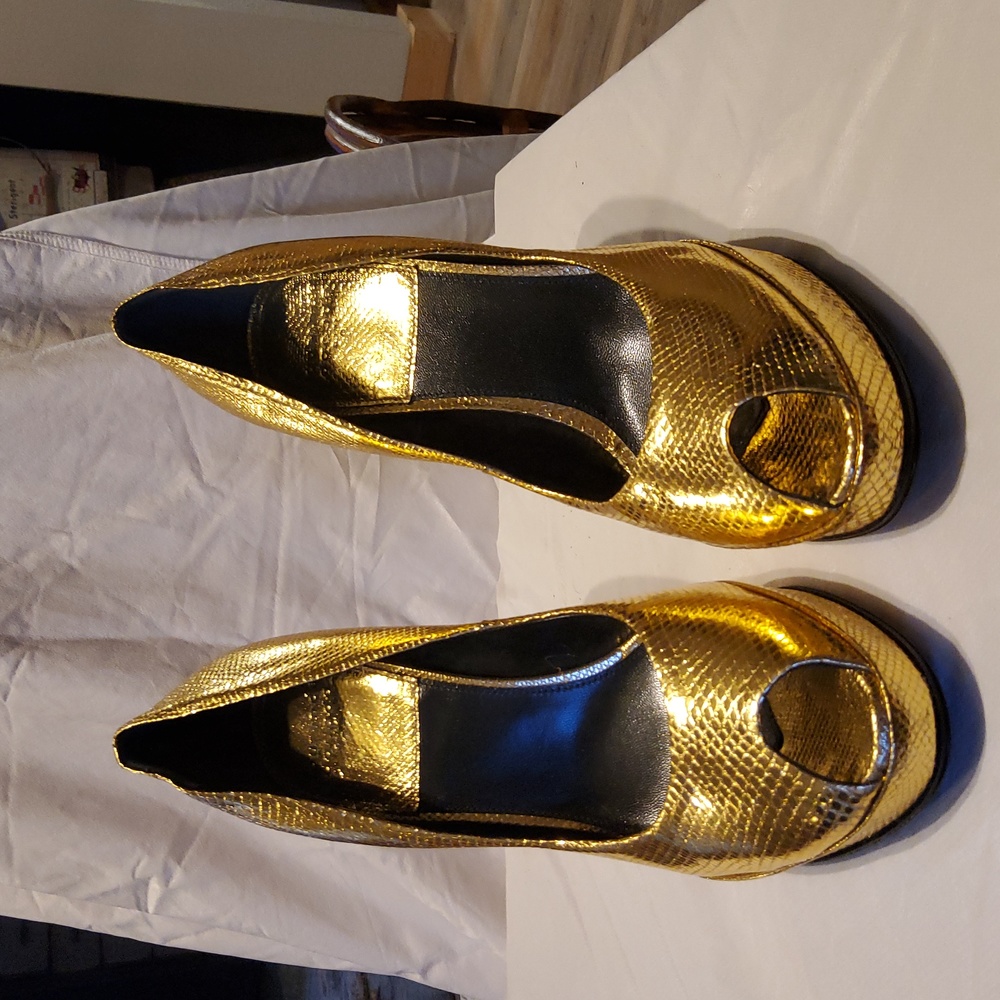 Gold peep toe heels.